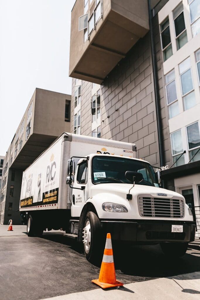 moving-company-truck-in-front-of-apartment-building-20706511 Moving Company Truck in Front of Apartment Building